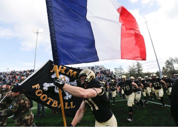 Army takes the field with American and French flag